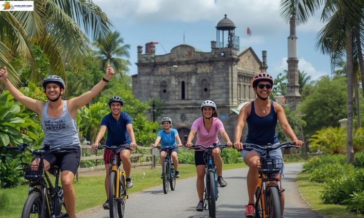 Group of people riding ebikes past a historic building surrounded by palm trees